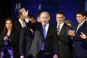 Israel's Prime Minister Netanyahu waves to supporters at the Likud-Yisrael Beitenu headquarters in Tel Aviv