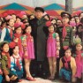 The great leader President Kim Il Sung poses with lovely children, embracing the children who enjoy themselves at amusement facilities in the newly-built Mangyongdae Fun Fair (April 6, 1982)