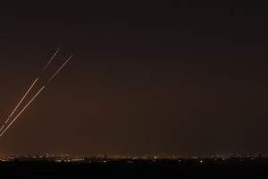 Rockets streaks are seen in the night sky after they are launched from the northern Gaza Strip towards Israel